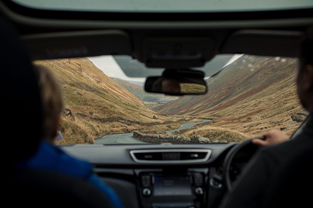 in car view of lake drive